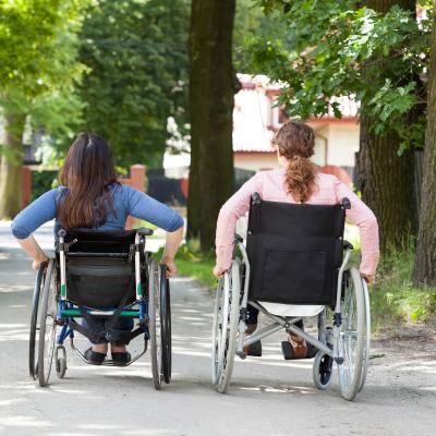 two girls in wheelchairs